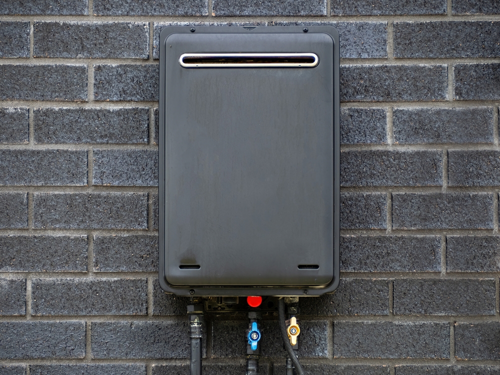 tankless water heater and traditional heater side-by-side